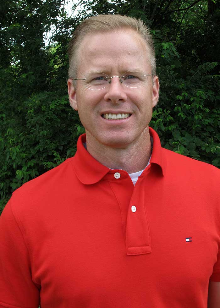 Picture of Dr. James M. Cox II, DC, LAc Picture of Dr. James M. Cox II, DC, LAc in a red polo